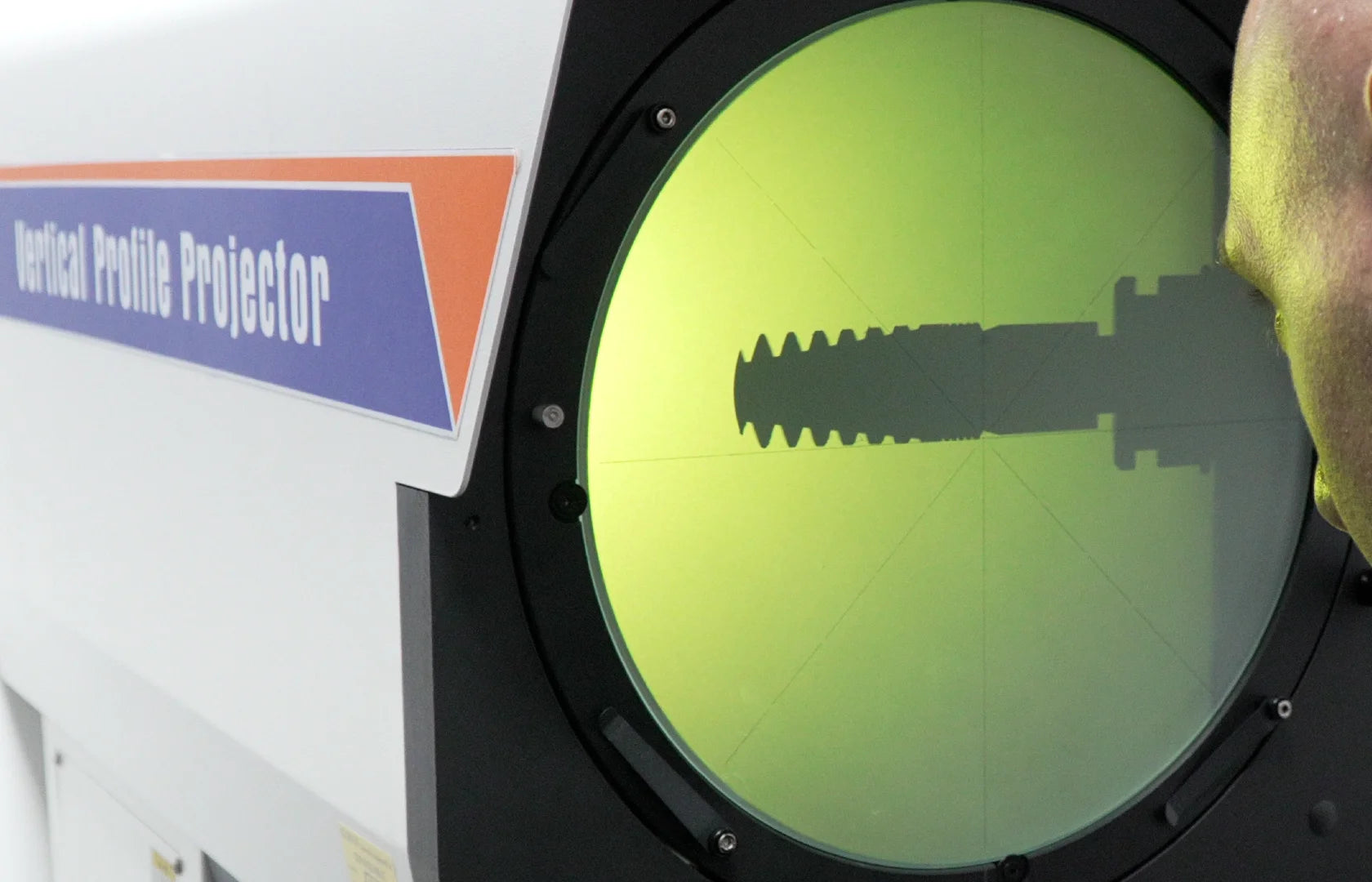 Precision measurement setup used to inspect dental implant dimensions during quality control.