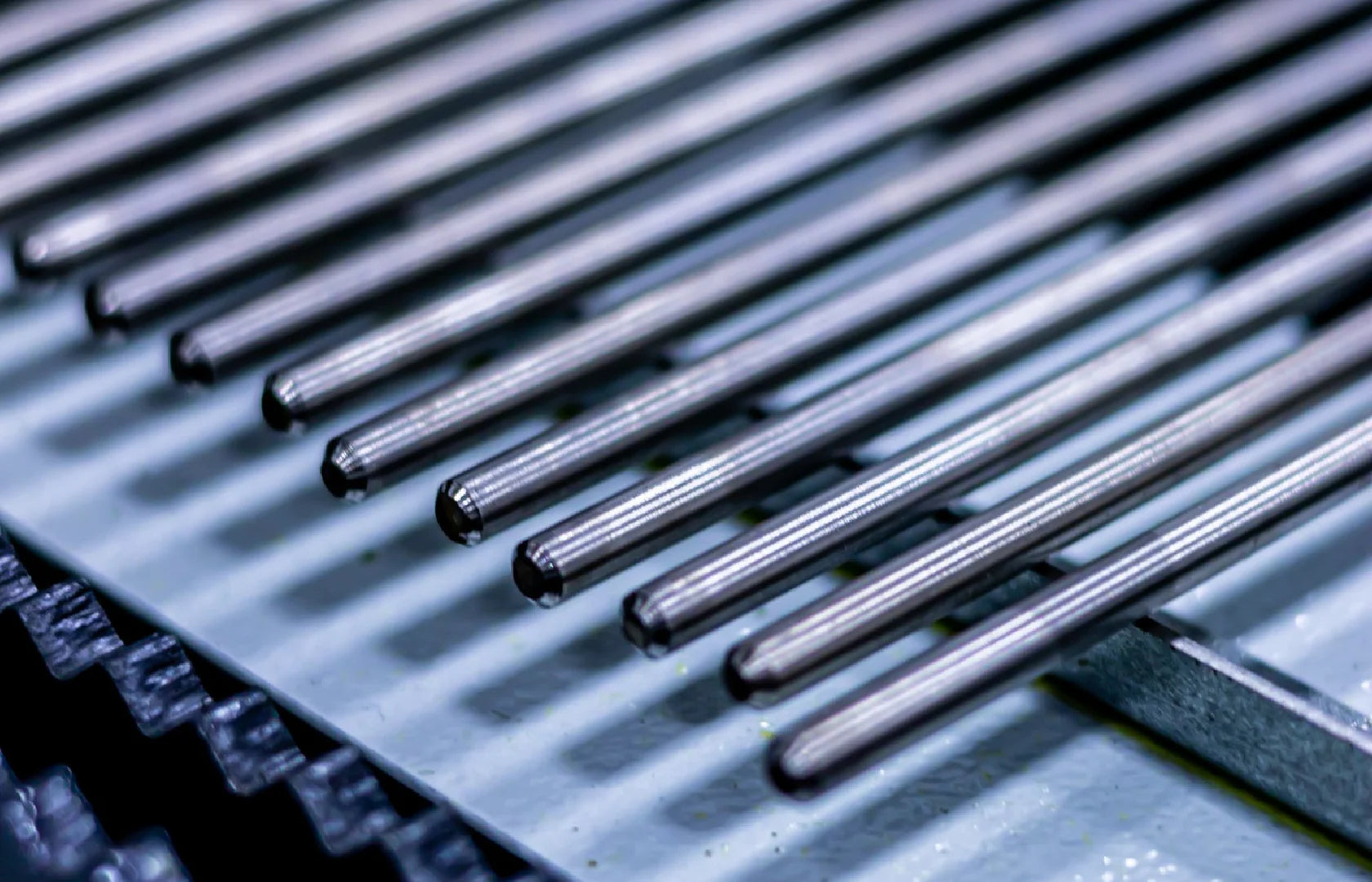 Titanium Grade 5 rods arranged in precision order before dental implant manufacturing.