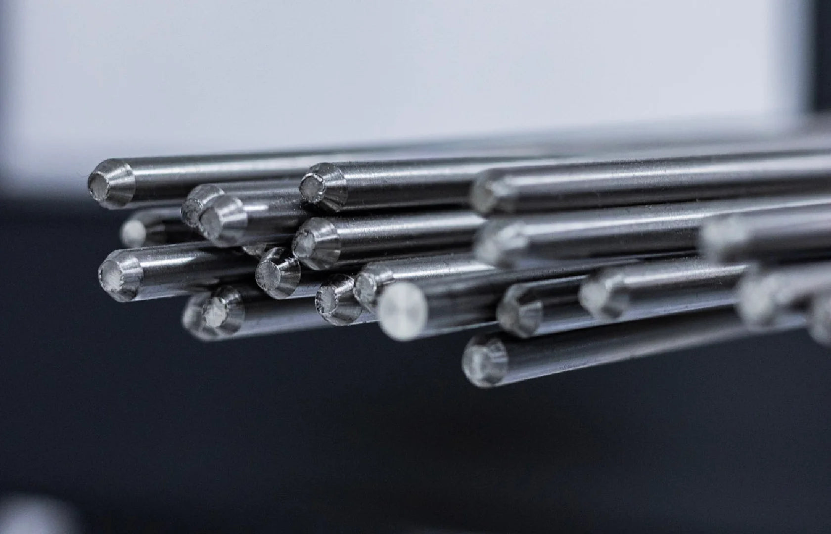 Close-up of Titanium Grade 5 rod ends prepared for precision machining.