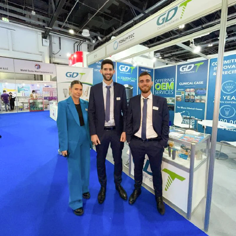GDT Dental Implants team at the AEEDC 2022 exhibition booth in Dubai, UAE.