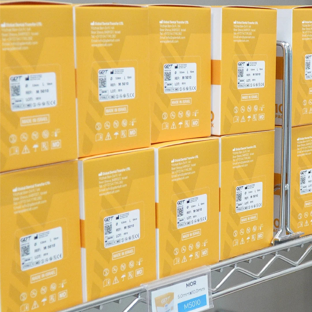 Stacked orange boxes of MOR GDT Dental Implants